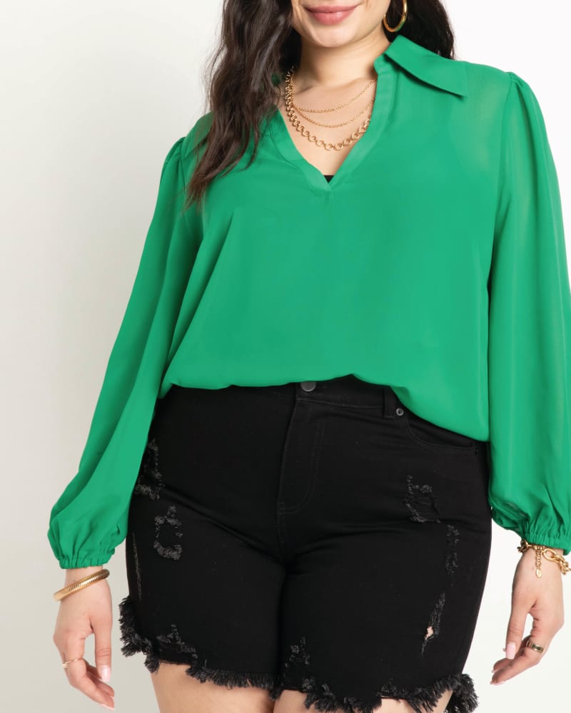 Front of a model wearing a size 14 Katalina Pointed Collar Blouse in Kelly Green by ELOQUII. | dia_product_style_image_id:195721